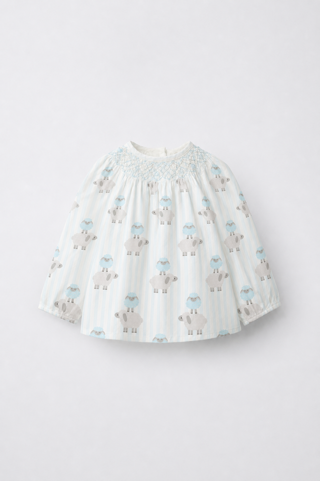 Baby wearing Anaario Blue Sheep Smocked pale blue stripes with sheep prints co-ord set, newborn to 24 months