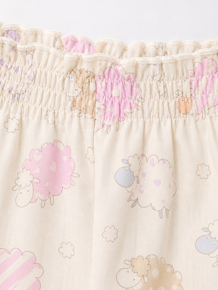 Baby wearing Anaario Cream Sheep Peplum cream with pastel sheep prints co-ord set, newborn to 24 months