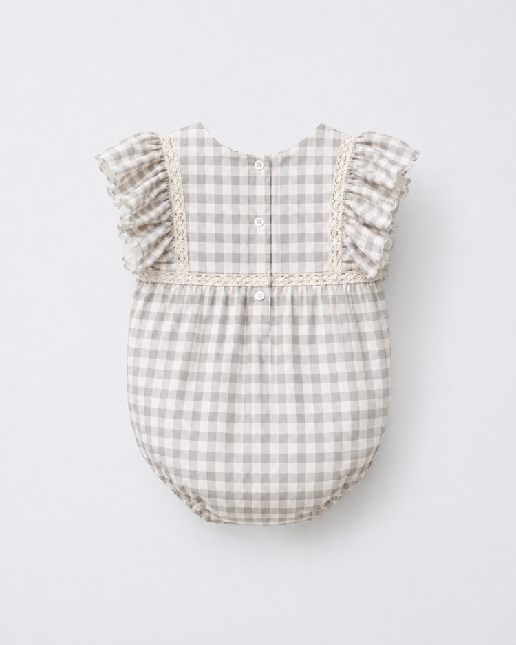 Baby wearing Anaario Grey Gingham Lace Frill Romper with frill sleeves, newborn to 24 months
