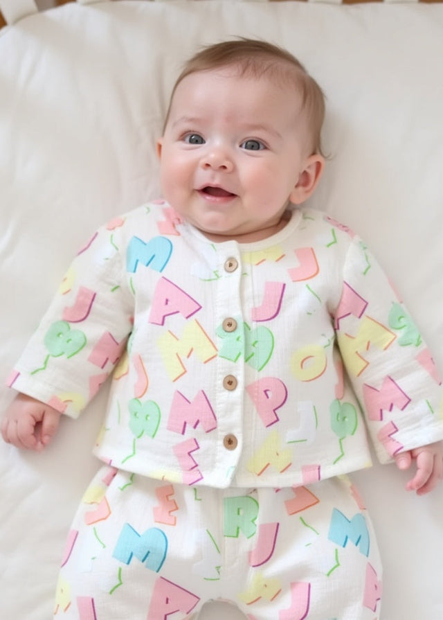 Baby wearing Anaario Pastel Multicolor Alphabets organic mulmul cotton Sakura set, newborn to 24 months