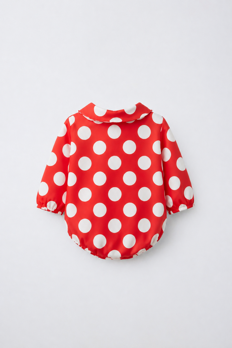 Baby wearing Anaario Crimson Dot Collared red with white polka dots romper with Peter Pan collar, newborn to 24 months