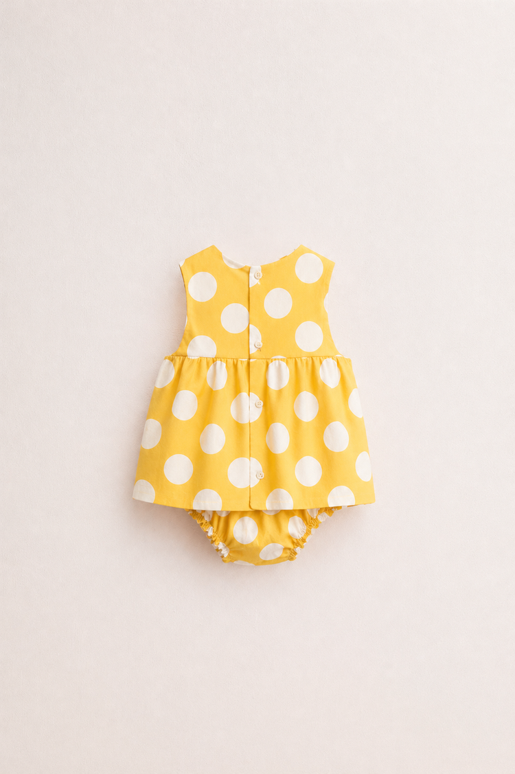 Baby wearing Anaario Yellow Polka Dot white with yellow polka dots dress set, newborn to 24 months
