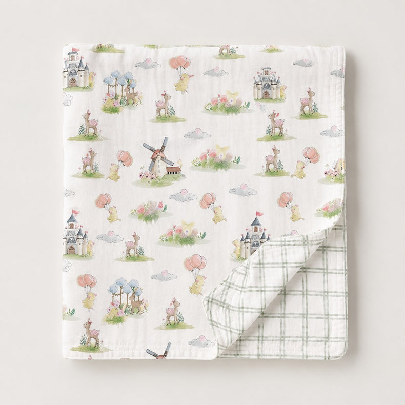 Carnival Windmill bamboo baby quilt — draped