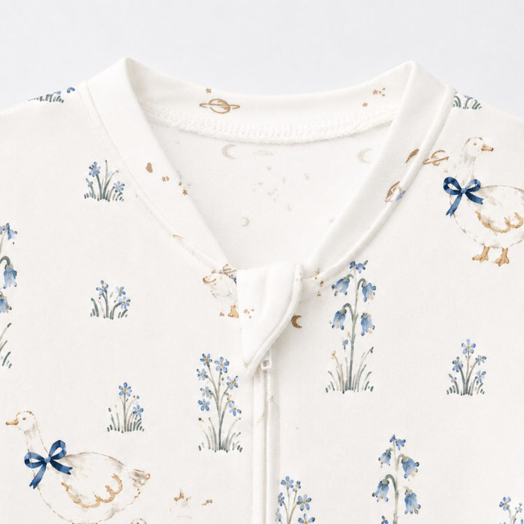 Duck & Meadow bamboo cotton baby sleepsuit — bamboo cotton onesie romper flatlay