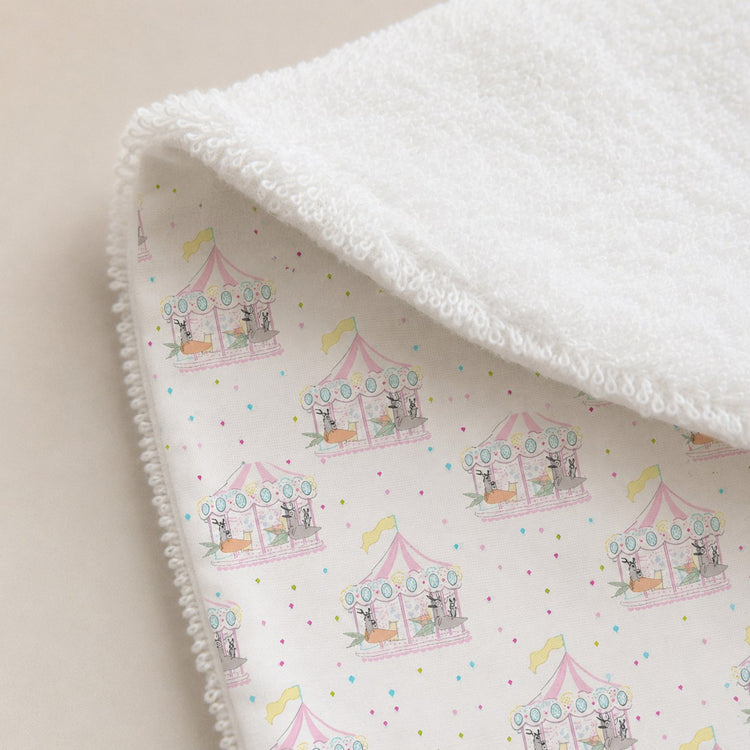 Merry-Go-Round bamboo baby bib — soft bamboo cotton flatlay