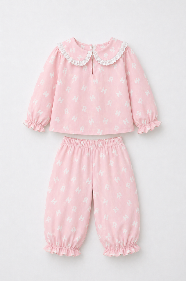 Girl wearing Anaario Pink Alphabet Night Suit