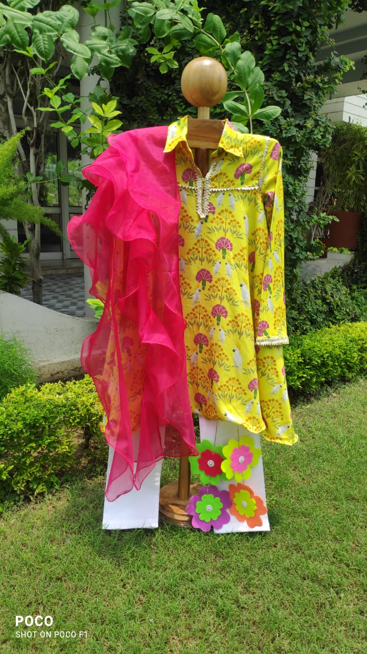 Girl wearing Anaario Marigold Meadow Anarkali Set, marigold yellow floral and bird print kurta with hot pink dupatta