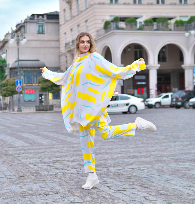 Person wearing Anaario City Girl Co-ord Set, white and yellow abstract print oversized top and matching pants