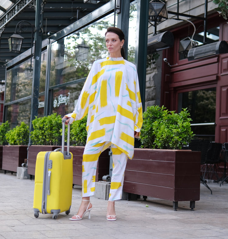 Person wearing Anaario City Girl Co-ord Set, white and yellow abstract print oversized top and matching pants