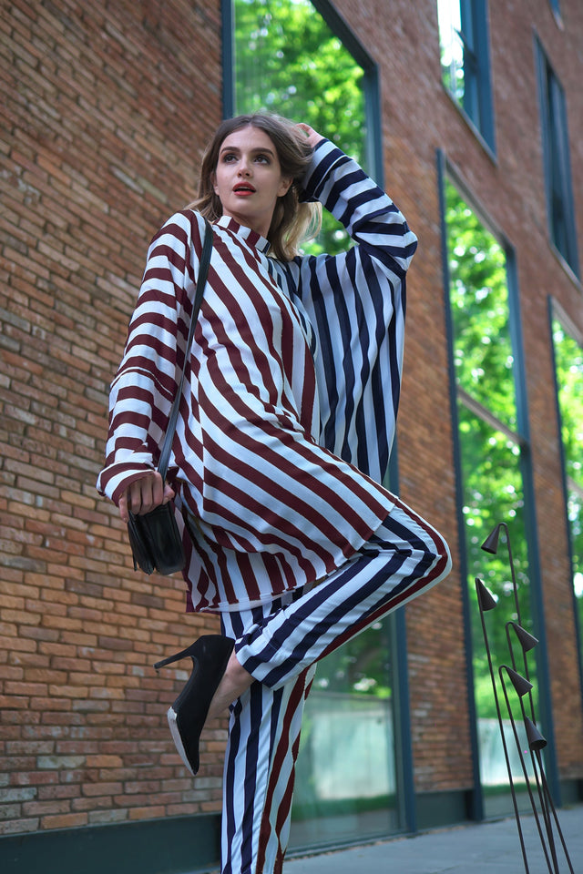 Person wearing Anaario City Girl Co-ord Set, mixed burgundy and navy stripe shirt and matching pants