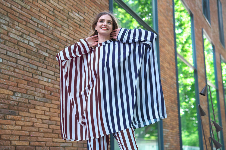 Person wearing Anaario City Girl Co-ord Set, mixed burgundy and navy stripe shirt and matching pants