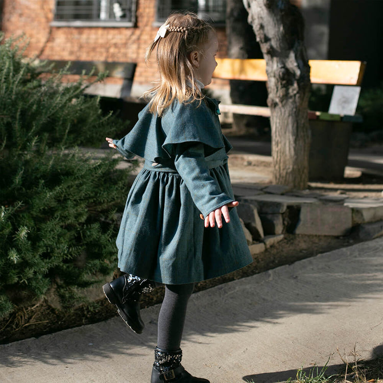 Girl wearing Anaario Diana Capelet Coat, teal wool-look coat with cape collar and tie waist