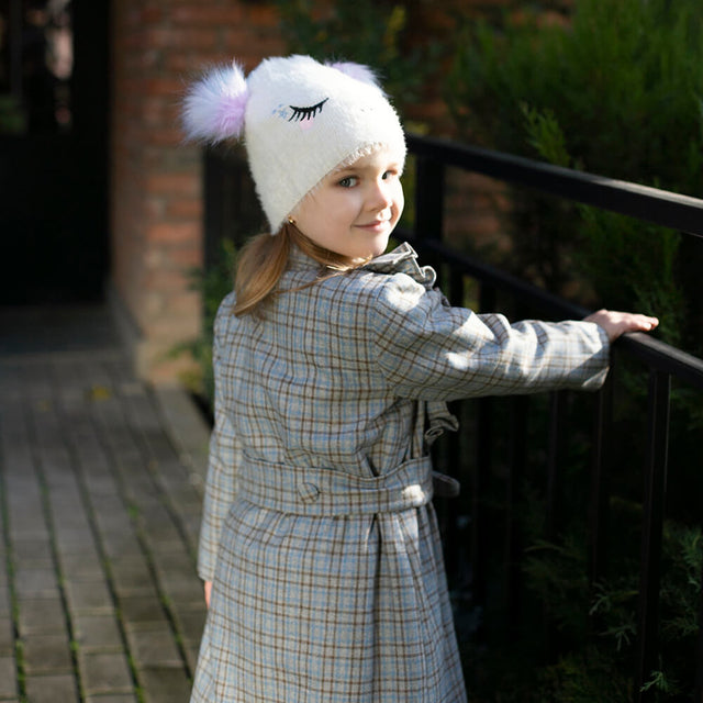 Girl wearing Anaario Meadow Mist Pea Coat, grey plaid coat with heart appliques and tie waist
