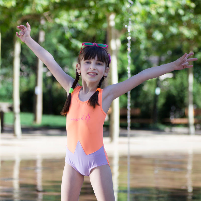 Girl wearing Anaario Orange Purple Star One Piece swimsuit, orange and lilac colorblock one-piece swimsuit with star-point seam design