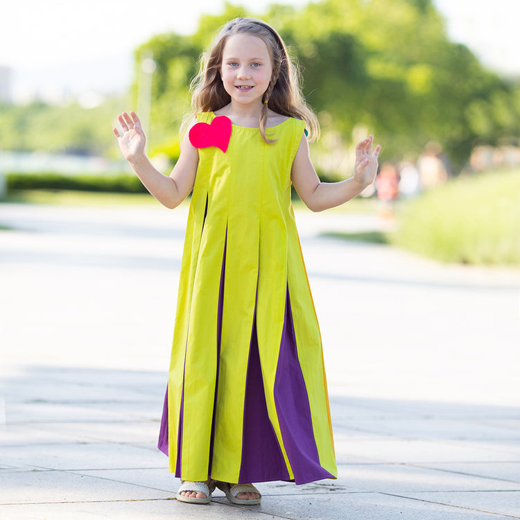 Girl wearing Anaario Pixie Dixie colorblock maxi dress in lime green, purple, and orange