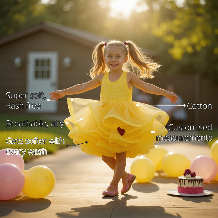 The Buttercup Twirl Girls' Frock features