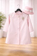Anaario Park Avenue Princess Coat Set detail — pink coat with pearl brooch