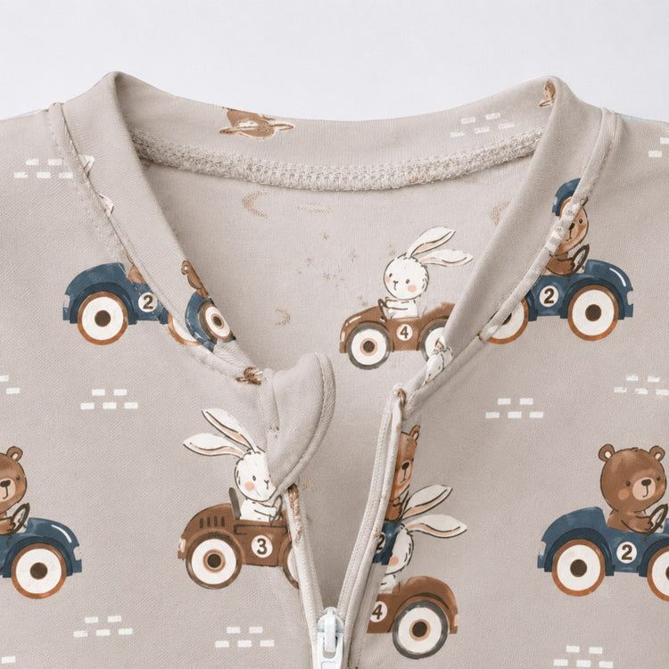 Animals on Wheels bamboo cotton baby sleepsuit — bamboo cotton onesie romper flatlay