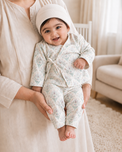 Baby wearing Anaario Aqua Floral Wrap soft aqua floral on ivory co-ord set, newborn to 24 months
