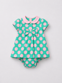 Baby wearing Anaario Aqua Pink Polka Dot Bow short-sleeve romper with Peter Pan collar, newborn to 24 months