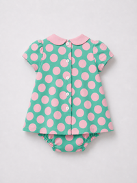 Baby wearing Anaario Aqua Pink Polka Dot Bow short-sleeve romper with Peter Pan collar, newborn to 24 months