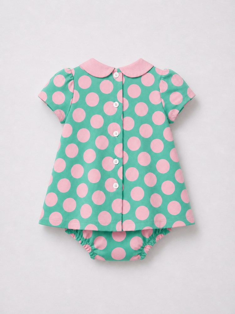 Baby wearing Anaario Aqua Pink Polka Dot Bow short-sleeve romper with Peter Pan collar, newborn to 24 months