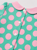 Baby wearing Anaario Aqua Pink Polka Dot Bow short-sleeve romper with Peter Pan collar, newborn to 24 months