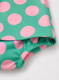 Baby wearing Anaario Aqua Pink Polka Dot Bow short-sleeve romper with Peter Pan collar, newborn to 24 months