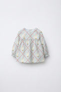 Baby wearing Anaario Blue Goose soft blue with goose and lattice prints co-ord set, newborn to 24 months