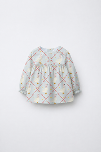 Baby wearing Anaario Blue Goose soft blue with goose and lattice prints co-ord set, newborn to 24 months