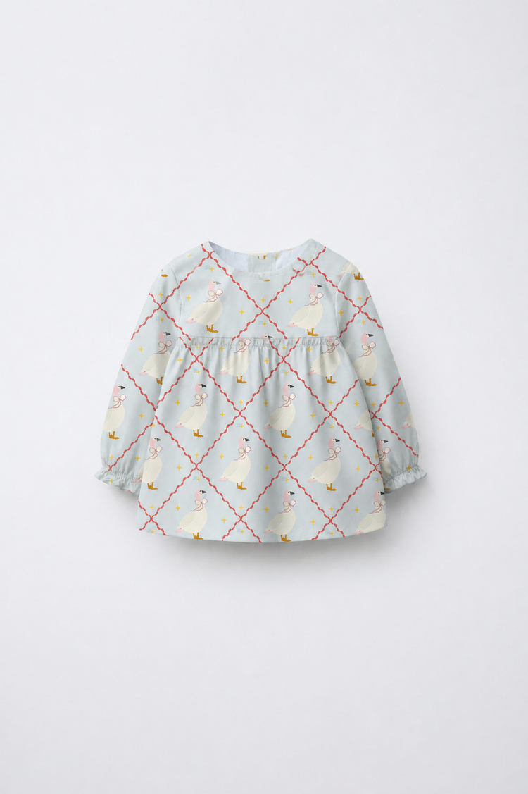 Baby wearing Anaario Blue Goose soft blue with goose and lattice prints co-ord set, newborn to 24 months