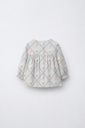 Baby wearing Anaario Blue Goose soft blue with goose and lattice prints co-ord set, newborn to 24 months