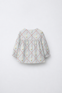 Baby wearing Anaario Blue Goose soft blue with goose and lattice prints co-ord set, newborn to 24 months