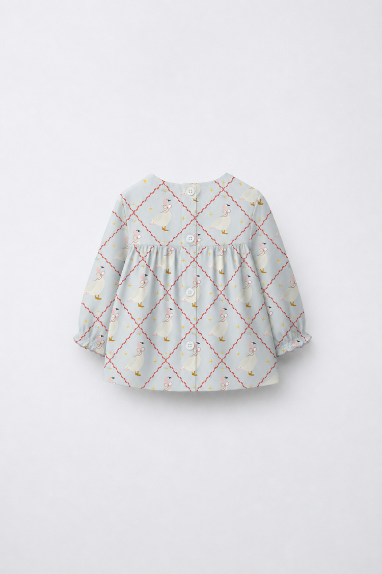Baby wearing Anaario Blue Goose soft blue with goose and lattice prints co-ord set, newborn to 24 months