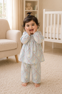 Baby wearing Anaario Blue Goose soft blue with goose and lattice prints co-ord set, newborn to 24 months