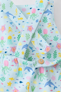 Baby wearing Anaario Sea Friends Pinafore light blue with ocean animals and sea-life prints romper, newborn to 24 months