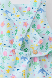 Baby wearing Anaario Sea Friends Pinafore light blue with ocean animals and sea-life prints romper, newborn to 24 months