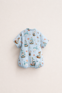 Baby wearing Anaario Ocean Sailor Wrap sky blue with boats whales penguins ocean prints romper, newborn to 24 months