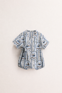 Baby wearing Anaario Blue Rocking Horse Wrap blue stripes with rocking horse prints romper, newborn to 24 months