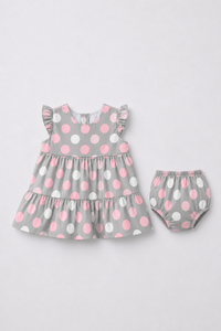 Baby wearing Anaario Blush Dot Tiered grey with pink and white polka dots tiered dress set, newborn to 24 months