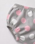 Baby wearing Anaario Blush Dot Tiered grey with pink and white polka dots tiered dress set, newborn to 24 months