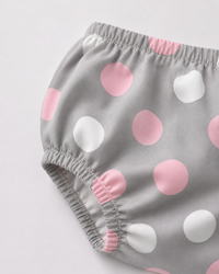 Baby wearing Anaario Blush Dot Tiered grey with pink and white polka dots tiered dress set, newborn to 24 months
