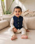 Baby wearing Anaario Cream Moon-Star Motif Jacket Kurta Set, cream kurta with navy moon-and-star embroidered jacket, newborn to 24 months