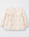 Baby wearing Anaario Cream Sheep Peplum cream with pastel sheep prints co-ord set, newborn to 24 months