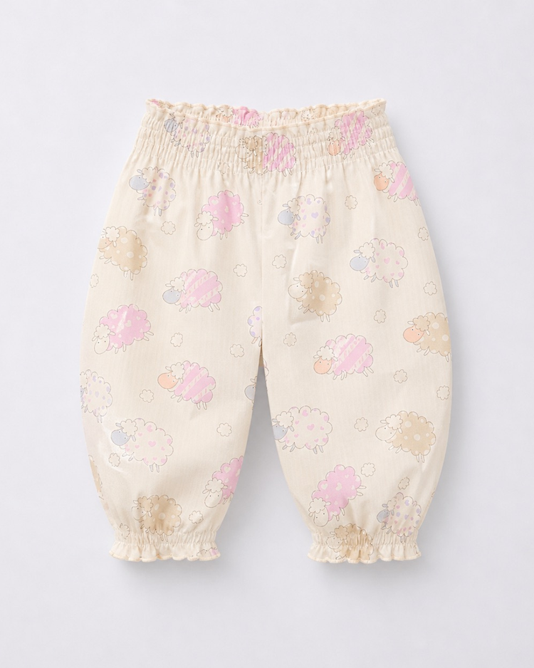 Baby wearing Anaario Cream Sheep Peplum cream with pastel sheep prints co-ord set, newborn to 24 months
