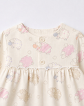 Baby wearing Anaario Cream Sheep Peplum cream with pastel sheep prints co-ord set, newborn to 24 months