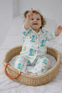 Baby wearing Anaario Dino-Kites organic mulmul cotton set, newborn to 24 months