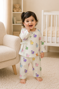 Baby wearing Anaario Colourful Sheep Wrap ivory base co-ord set, newborn to 24 months