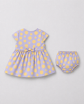 Baby wearing Anaario Lavender Dot Bow lavender with soft yellow polka dots dress set, newborn to 24 months