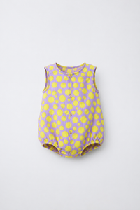 Baby wearing Anaario Lavender Yellow Polka Dot Button sleeveless romper, newborn to 24 months